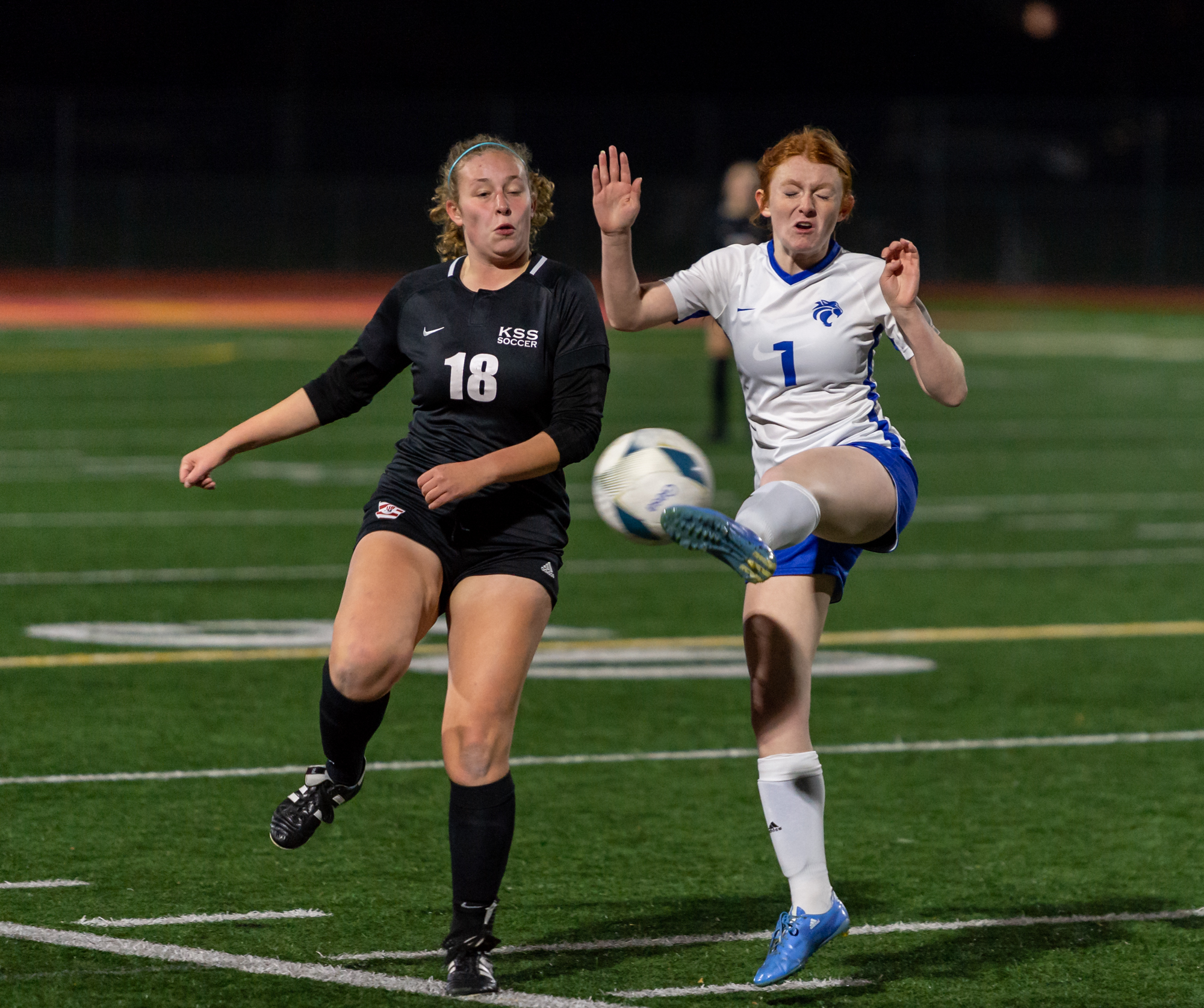 Klahowya sophomore Seraphina Bell and La Center senior forward Mikaela Bright compete for a loose ball in a 1A State girls soccer semifinal game on Friday, Nov. 17, 2023, at Mount Tahoma Stadium in Tacoma.
