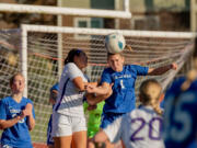Ridgefield junior midfielder Nora Martin wins a header on a corner kick in a 2A State girls soccer semifinal game on Friday, Nov. 17, 2023, at Mount Tahoma Stadium in Tacoma.
