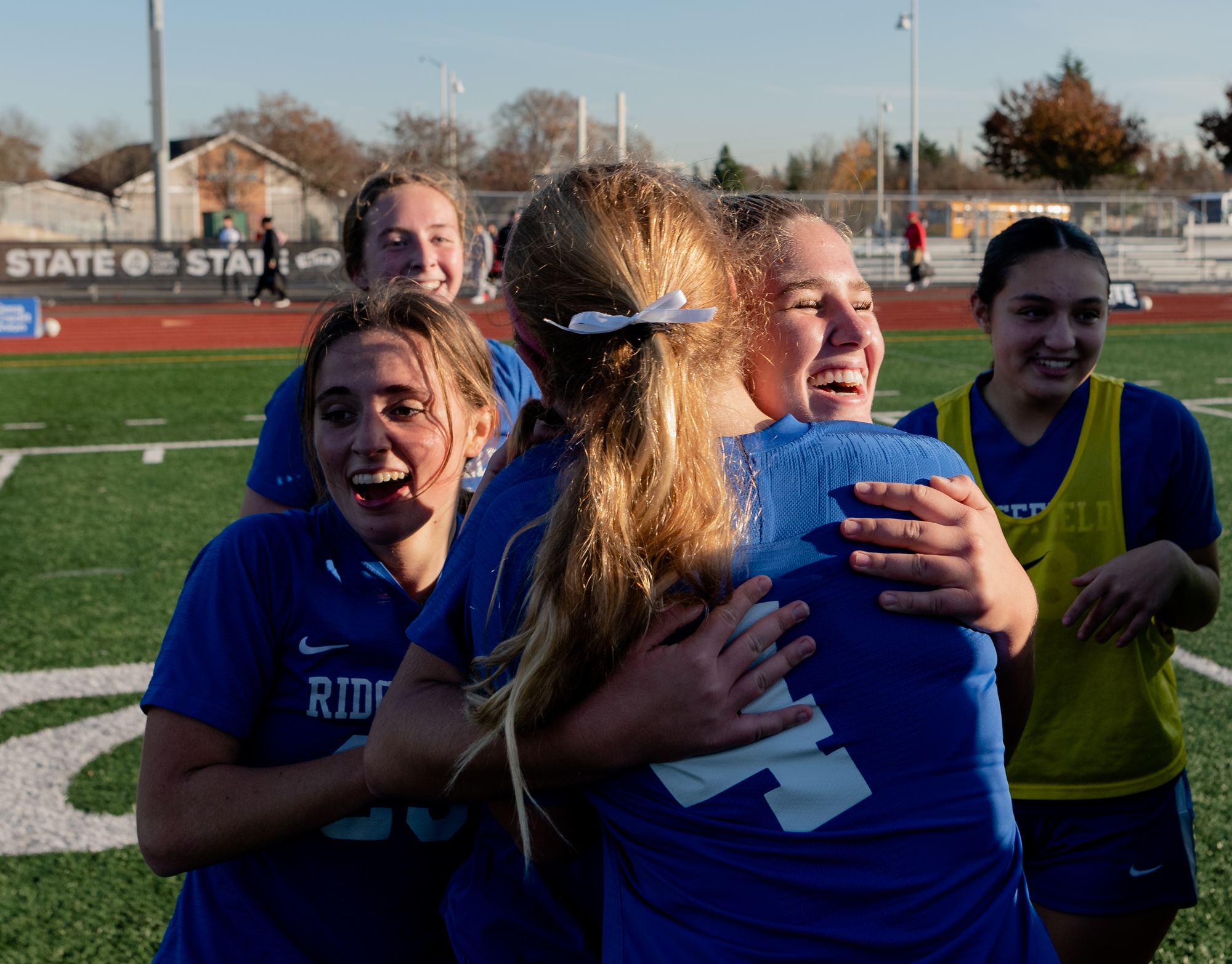 Ridgefield junior midfielder Nora Martin and Ridgefield senior defender Keaira Farley share a hug after a 1-0 win over Columbia River in a 2A State girls soccer semifinal game on Friday, Nov. 17, 2023, at Mount Tahoma Stadium in Tacoma.