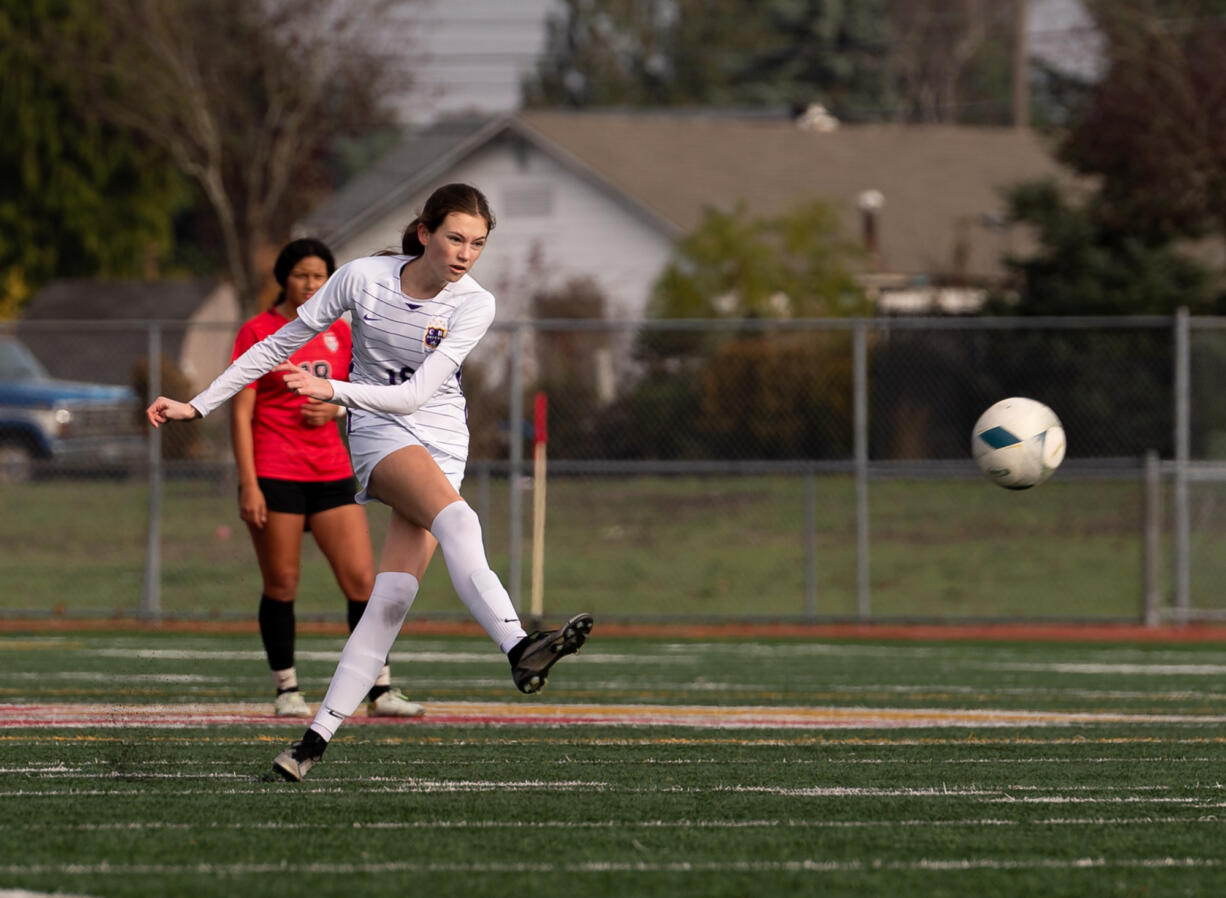 Columbia River junior defender Peyton Dukes shoots a 35-yard free kick which she scores in a 2A State girls soccer third-place game on Saturday, Nov. 18, 2023, at Mount Tahoma Stadium in Tacoma.