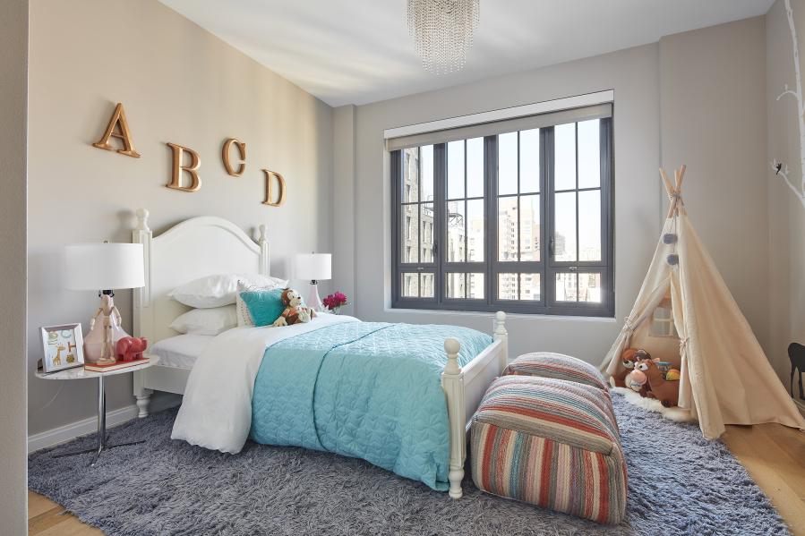 Textured and tactile materials in this bedroom create a child-friendly environment.