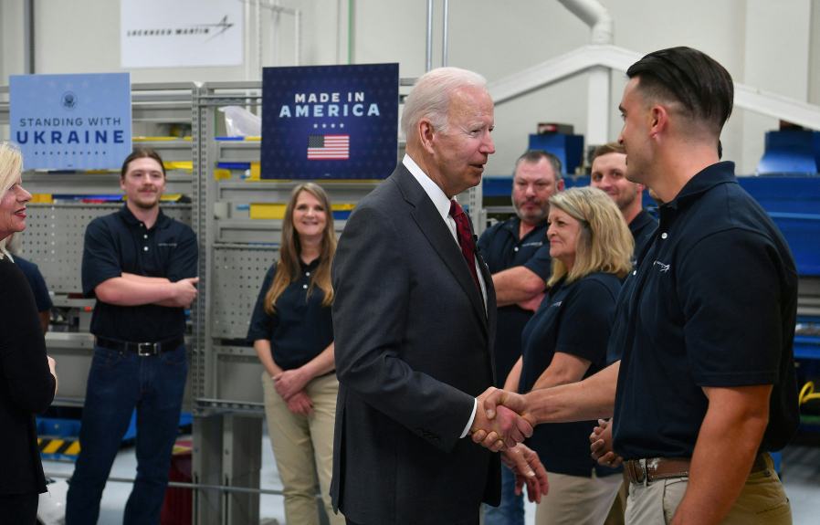 U.S. President Joe Biden shakes hands with employees as he tours the Lockheed Martins Pike County Operations facility in Troy, Alabama, on May 3, 2022.