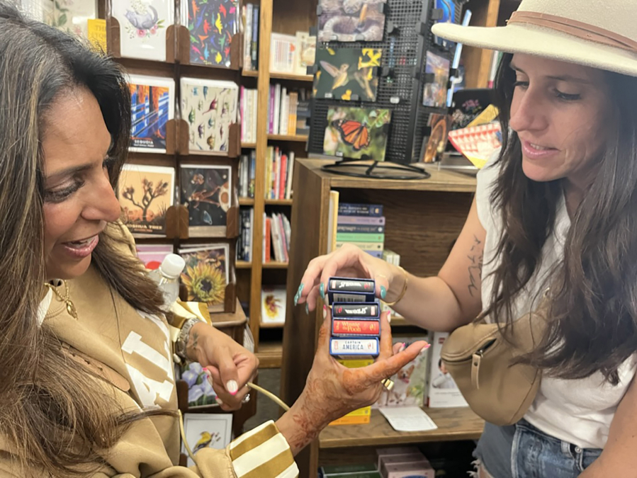 Meher Ali-Owens, left, and Sarah Ezrin check out miniature books at the Book Loft in Solvang, Calif.