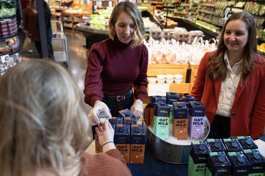 Sisters Christina Dorr Drake, left, and Elena Dorr Zienda share samples of Willa&rsquo;s Oat Milk at Lunds &amp; Byerly&rsquo;s in Minneapolis on Thursday, Oct. 19, 2023. (Shari L.