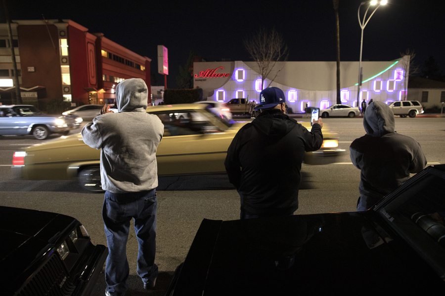 Spectators take in the scene on a cruise night on Van Nuys Boulevard in March 2021. (Myung J.