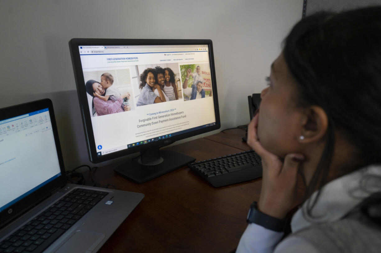 Theressa Ruiz, program manager at affordable housing nonprofit PRG Inc., looks at the new first generation housing assistance website to be launched next year from her office in Minneapolis on Nov. 22. PRG is helping to launch this new down payment program.