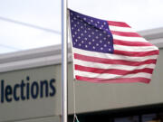 An American flag flutters in the wind outside the King County Elections office in 2020 in Tukwila.