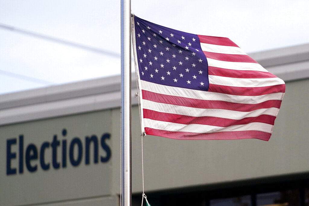 An American flag flutters in the wind outside the King County Elections office in 2020 in Tukwila.
