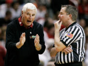 FILE - Texas Tech coach Bob Knight, left, argues a call with an NCAA official during a basketball game against Texas A&amp;M in Lubbock, Texas, Wednesday, Jan. 16, 2008. Knight earned his 900th career win in the 68-53 win over Texas A&amp;M. Bob Knight, the brilliant and combustible coach who won three NCAA titles at Indiana and for years was the scowling face of college basketball has died. He was 83. Knight's family made the announcement on social media Wednesday evening, Nov. 1, 2023.