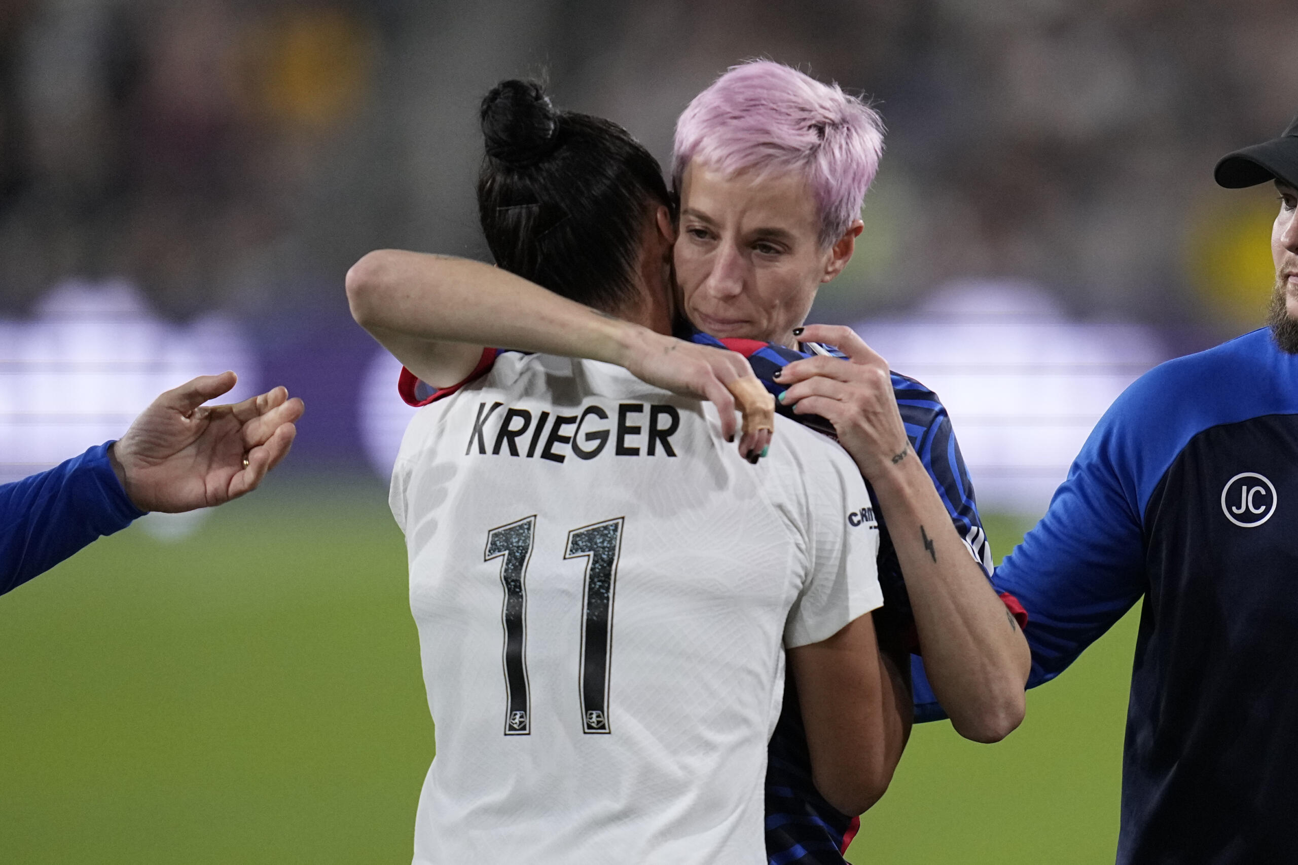 OL Reign forward Megan Rapinoe, right, embraces NJ/NY Gotham defender Ali Krieger as Rapinoe comes off the field after an injury during the first half of the NWSL Championship soccer game, Saturday, Nov. 11, 2023, in San Diego.
