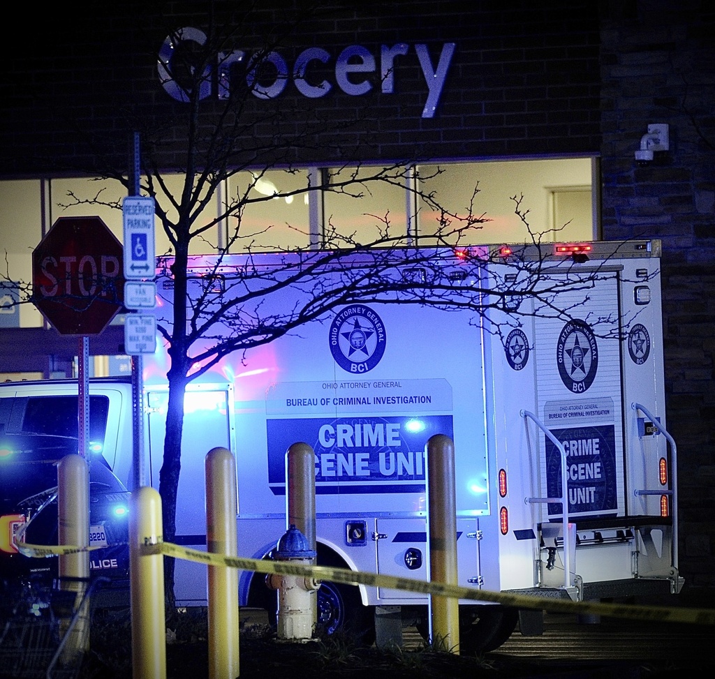 Police respond to the scene of a shooting on Monday, Nov. 20, 2023 in Beavercreek, Ohio.  Police say a shooter opened fire at a Walmart, wounding four people before apparently killing himself. The attack took place Monday night at a Walmart in Beavercreek, in the Dayton metropolitan area.
