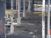 Debris is scattered about inside the customs plaza at the Rainbow Bridge border crossing, Wednesday, Nov. 22, 2023, in Niagara Falls, N.Y. The border crossing between the U.S. and Canada has been closed after a vehicle exploded at a checkpoint on a bridge near Niagara Falls. The FBI's field office in Buffalo said in a statement that it was investigating the explosion on the Rainbow Bridge, which connects the two countries across the Niagara River.