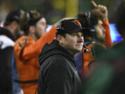 Oregon State coach Jonathan Smith looks up at the scoreboard during the second half of the team's NCAA college football game against Oregon on Friday, Nov. 24, 2023, in Eugene, Ore.