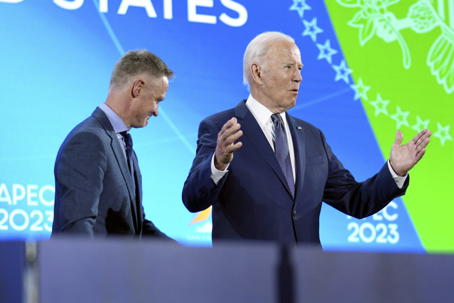 President Joe Biden gestures after Golden State Warriors head basketball coach Steve Kerr introduced him at a welcome reception for Asia-Pacific Economic Cooperative leaders at the Exploratorium, in San Francisco, Wednesday, Nov, 15, 2023.