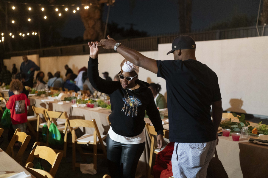 Andre Clements, left, and his wife, Vickki Willis, dance to music during a welcome dinner for the annual Families United 4 Justice Network Conference, hosted by the Black Lives Matter Global Network Foundation at its mansion in the Studio City neighborhood of Los Angeles, Thursday, Sept. 28, 2023. Willis said her son, Alteriq Pleasant, died in 2022, while in custody at Cook County Jail in Chicago. (AP Photo/Jae C.