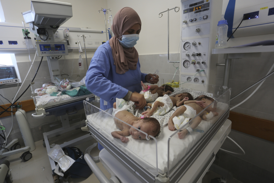 A nurse cares for prematurely born Palestinian babies that were brought from Shifa Hospital in Gaza City to the hospital in Rafah, Gaza Strip, Sunday, Nov. 19, 2023.