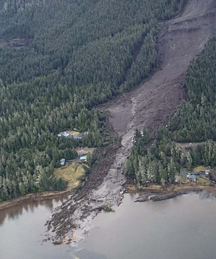 This image from video provided by Sunrise Aviation shows the landslide that occurred the previous evening near Wrangell, Alaska, on Nov. 21, 2023. Authorities said at least one person died and others were believed missing after the large landslide roared down a mountaintop into the path of three homes.