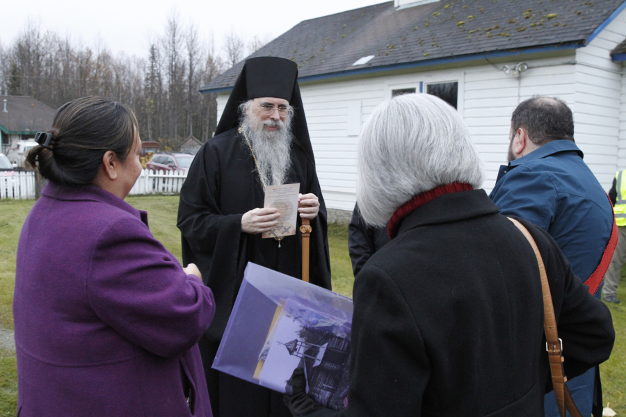 Bishop Alexei, the head of the Orthodox Church in Alaska, is shown Oct. 13, 2023, speaking to others gathered at a ceremony marking the beginning of a restoration project at the old St. Nicholas Church in Eklutna, Alaska. The Orthodox church is the oldest standing building in the Municipality of Anchorage.