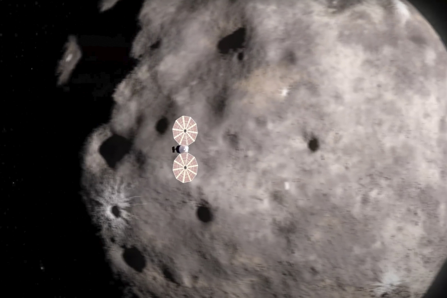 This image from a video animation provided by NASA depicts the Lucy spacecraft approaching an asteroid. On Wednesday, Nov. 1, 2023, Lucy  encountered the first of 10 asteroids on its long journey to Jupiter.