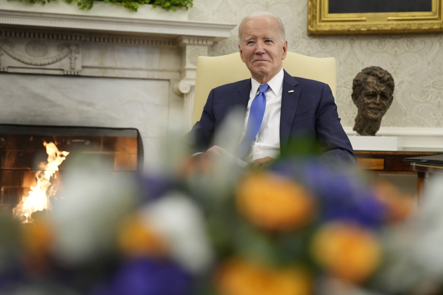 President Joe Biden listens as he meets with Chile's President Gabriel Boric in the Oval Office of the White House, Thursday, Nov. 2, 2023, in Washington.