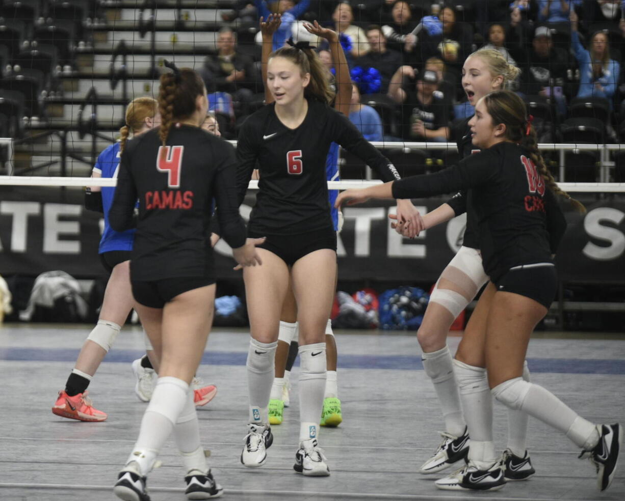 Camas players, from left, Emmah Sanchez, Avery Walunas, Ella Thompson and Mia Thorburn gather after a point against Curtis in the Class 4A state volleyball tournament on Saturday, Nov.