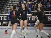 Camas players, from left, Emmah Sanchez, Avery Walunas, Ella Thompson and Mia Thorburn gather after a point against Curtis in the Class 4A state volleyball tournament on Saturday, Nov.