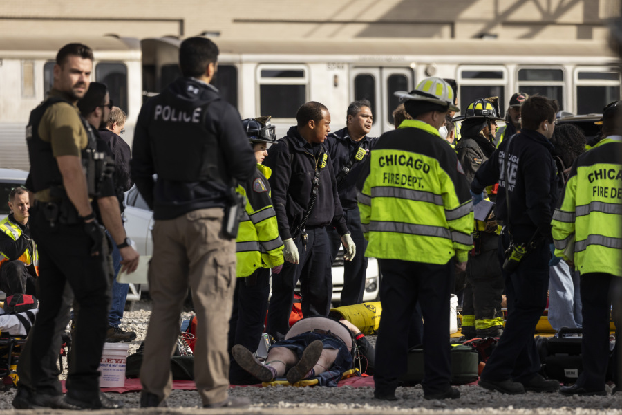 Chicago Fire Department and Chicago Police Department personnel triage patients at the scene after a Chicago Transit Authority train crashed into a piece of equipment that was on the rails near the Howard CTA station on the North Side, Thursday, Nov. 16, 2023 in Chicago.