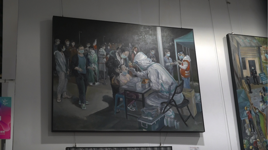 An art work depicting a Covid testing scene by Zeng Fanzhi, an retired architect turned artist, is seen at the Beijing art exposition in Beijing, Friday, Sept. 8, 2023. Zeng painted stark, realist portrayals of life in China under zero-COVID, saying he did so to capture a unique moment in history.