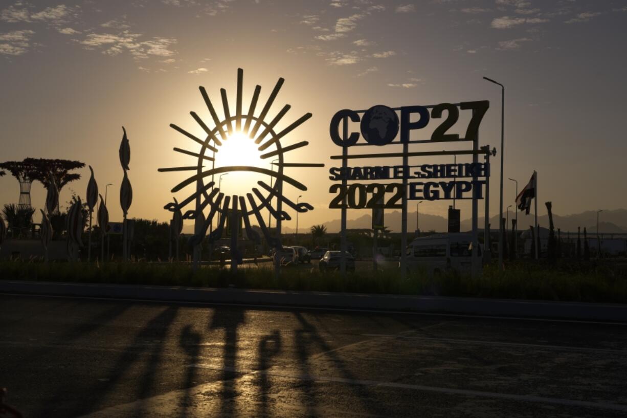 The sun sets behind the COP27 logo outside the venue of the COP27 U.N. Climate Summit on Nov. 12, 2022, in Sharm el-Sheikh, Egypt.