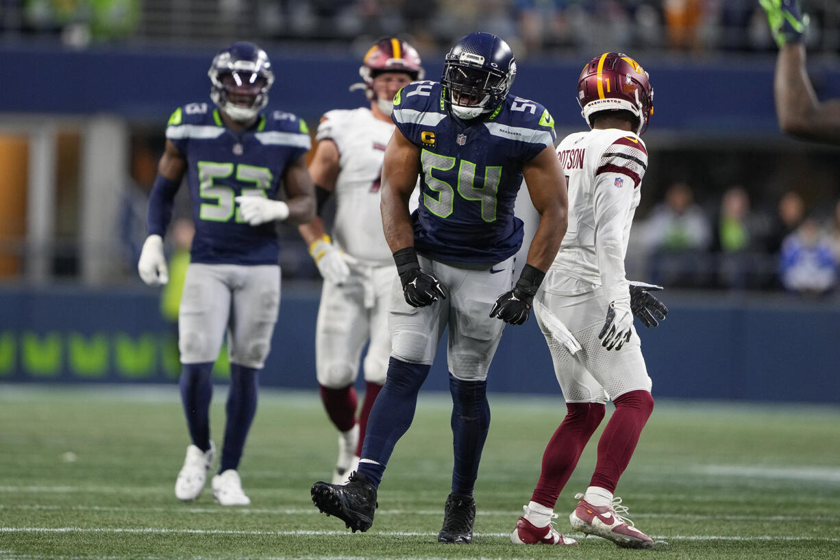 Seattle Seahawks linebacker Bobby Wagner (54) reacts after breaking up a pass to Washington Commanders wide receiver Jahan Dotson (1) during the second half of an NFL football game, Sunday, Nov. 12, 2023, in Seattle.