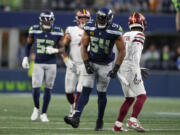 Seattle Seahawks linebacker Bobby Wagner (54) reacts after breaking up a pass to Washington Commanders wide receiver Jahan Dotson (1) during the second half of an NFL football game, Sunday, Nov. 12, 2023, in Seattle.