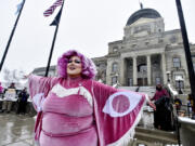 FILE - Scenes from a drag show at the Montana Capitol held in protest to a slate of bills aimed at how trans Montanans live, April 13, 2023, in Helena, Mont. Opponents of a law that restricted drag performances and banned drag reading events at public schools and libraries asked a federal judge late Tuesday, Nov. 28 to declare the law unconstitutional without the case going to trial. The motion for summary judgment argues there is no dispute over key facts in the case. The law has already been blocked under a preliminary injunction issued in October.