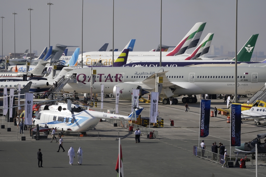 People visit the planes during the opening day of the Dubai Air Show, United Arab Emirates, Monday, Nov. 13, 2023.
