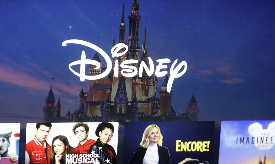 FILE - In this Nov. 13, 2019, photo, a Disney logo forms part of a menu for the Disney Plus movie and entertainment streaming service on a computer screen in Walpole, Mass.  Disney reports earnings on Wednesday, Nov. 8, 2023.