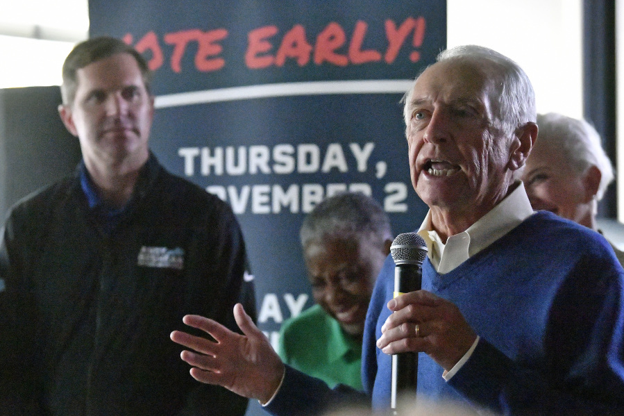 Former Kentucky Governor Steve Beshear, right, introduces his son, and Democratic Gubernatorial candidate for re-election Andy Beshear during a stop of his statewide bus tour in Richmond, Ky., Monday, Oct. 30, 2023. (AP Photo/Timothy D.