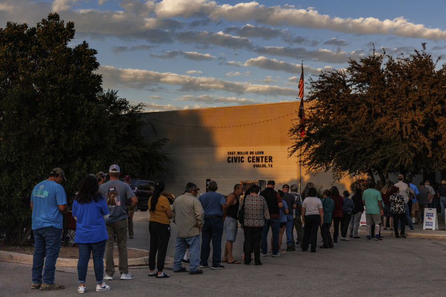 People wait in a long line outside of the SSGT Willie de Leon Civic Center to cast their ballot on Election Day, Tuesday evening, Nov. 7, 2023, in Uvalde, Texas.  In Uvalde&rsquo;s first mayoral race since the Robb Elementary School shooting,  Cody Smith won back the job Tuesday over Kimberly Mata-Rubio, a mother who has led calls for tougher gun laws since her daughter was among the 19 children killed in the 2022 attack.