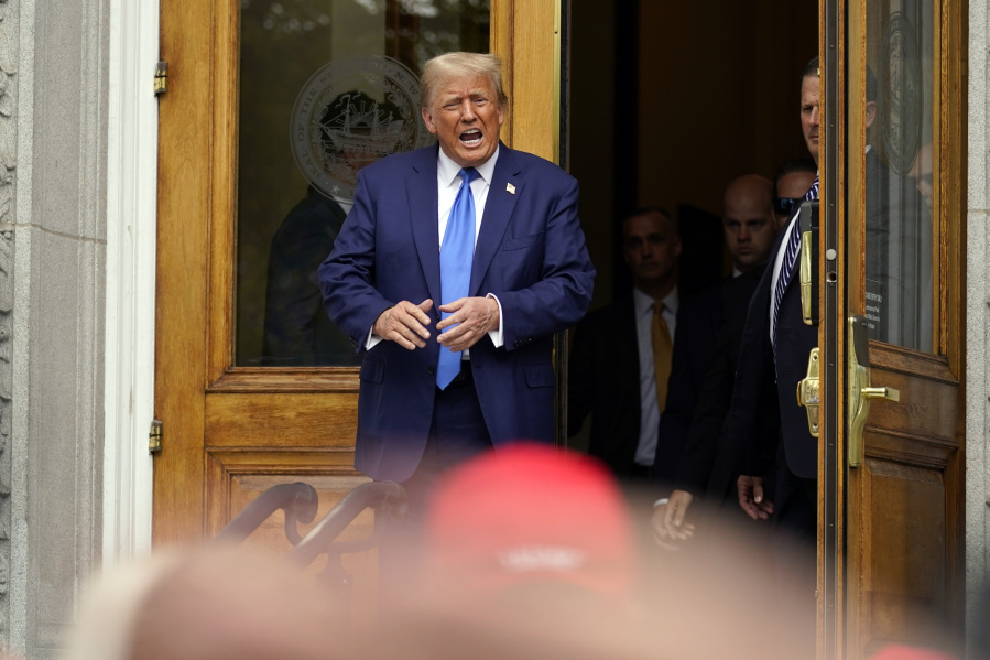 Republican presidential candidate former President Donald Trump departs after signing papers to be on the 2024 Republican presidential primary ballot at the New Hampshire Statehouse on Oct. 23 in Concord, N.H.