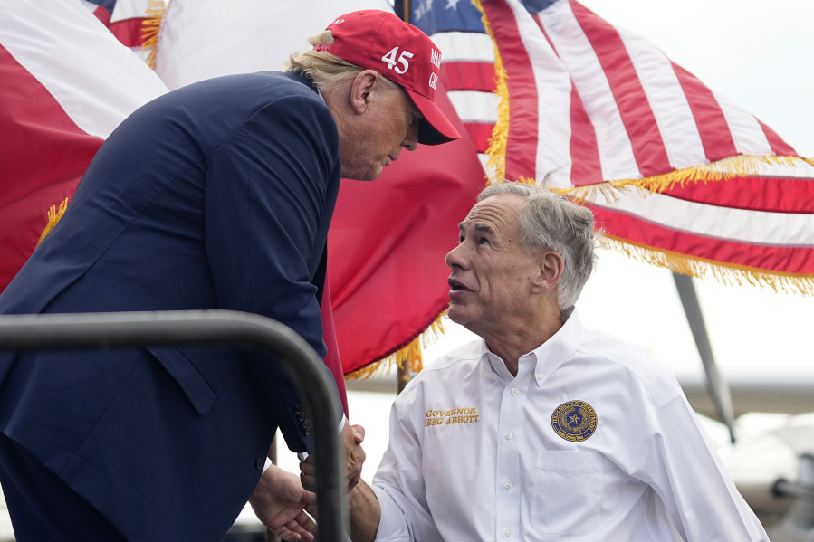 Republican presidential candidate and former President Donald Trump, left, shakes hands with Texas Gov. Greg Abbott, right, after he received Abbott&#039;s endorsement at the South Texas International Airport Sunday, Nov. 19, 2023, in Edinburg, Texas.