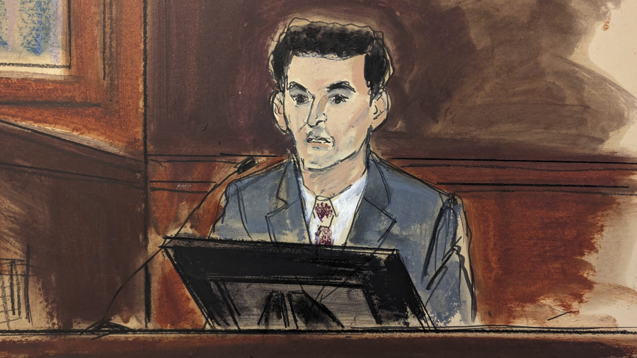 In this courtroom sketch, FTX founder Sam Bankman-Fried is questioned during his trial in Manhattan federal court, Thursday, Oct. 26, 2023, in New York.
