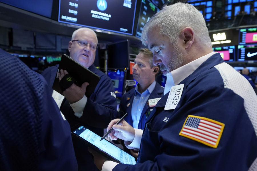 Edward McCarthy, right, works with fellow traders on the floor of the New York Stock Exchange, Wednesday, Nov. 15, 2023. Wall Street is ticking higher Wednesday and adding a bit more to its big rally from a day before.
