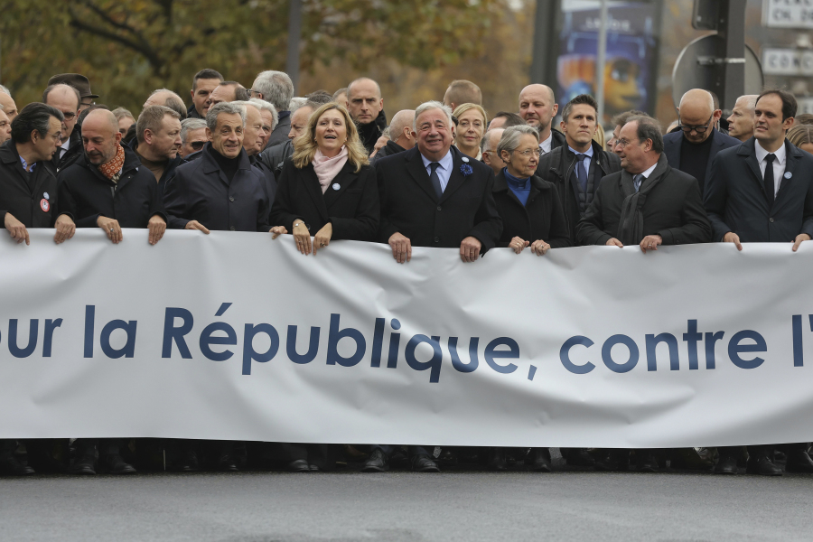 French Senate President Gerard Larcher, center, , President of the French National Assembly Yael Braun-Pivet, fourth left, French Prime Minister Elisabeth Borne third right, France&rsquo;s former President Francois Hollande, second right, President of the Representative Council of French Jewish Institutions (CRIF) Yonathan Arfi, right, and Former French prime minister stand behind a banner which reads as &ldquo;For The Republic, Against anti-Semistism&rdquo; a demonstration against anti-Semitism in Paris, Sunday, Nov. 12, 2023.