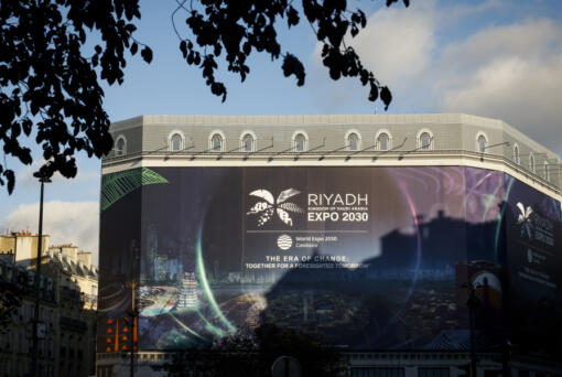 A canvas decorated with a commercial promoting the Riyadh Expo 2030 protects a building under renovation, Tuesday, Nov. 28, 2023 in Paris. In a high-profile showdown, Rome, Busan and Riyadh are the top contenders to become the host city of the 2030 World Expo, with the organizing body choosing the winner on Tuesday.