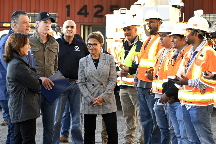 Vice President Kamala Harris, left, greets freeway construction workers with Sen. Alex Padilla, California Gov. Gavin Newsom, third from left, and Los Angeles Mayor Karen Bass, center, and congratulates them on the I-10 freeway, which was closed by an underpass fire on Saturday, Nov. 11, 2023, in Los Angeles, Sunday, Nov. 19.