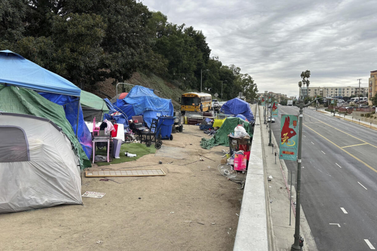 Tents line an overpass on North Hill Street above Cesar Chavez Avenue near U.S. 101 in Los Angeles, Wednesday, Nov. 15, 2023.
