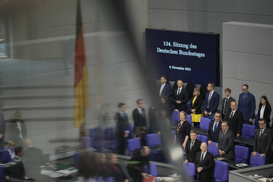 German Chancellor Olaf Scholz, bottom right, arrives for a debate at the parliament Bundestag about antisemitism and the protection of Jewish life in Germany, on the 85th anniversary of the November 1938 progroms in Germany and Austria, in central Berlin, Germany, Thursday, Nov. 9, 2023. According to Israel&rsquo;s Yad Vashem Holocaust memorial, the Nazis killed at least 91 people, vandalized 7,500 Jewish businesses and burned more than 1,400 synagogues during Nov. 9, 1938 pogroms known as Kristallnacht or &lsquo;Night of broken Glass&rsquo;.