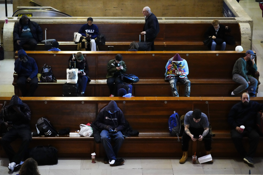 Traveler wait to board their Amtrak trains ahead of the Thanksgiving Day holiday at 30th Street Station in Philadelphia, Wednesday, Nov. 22, 2023.