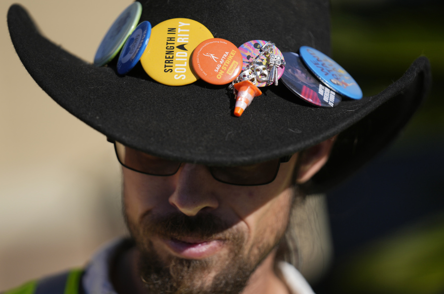 SAG-AFTRA captain Miles Berman wears solidarity pins on his hat on the striking actors&rsquo; picket line outside Paramount Pictures studio, Friday, Nov. 3, 2023, in Los Angeles.