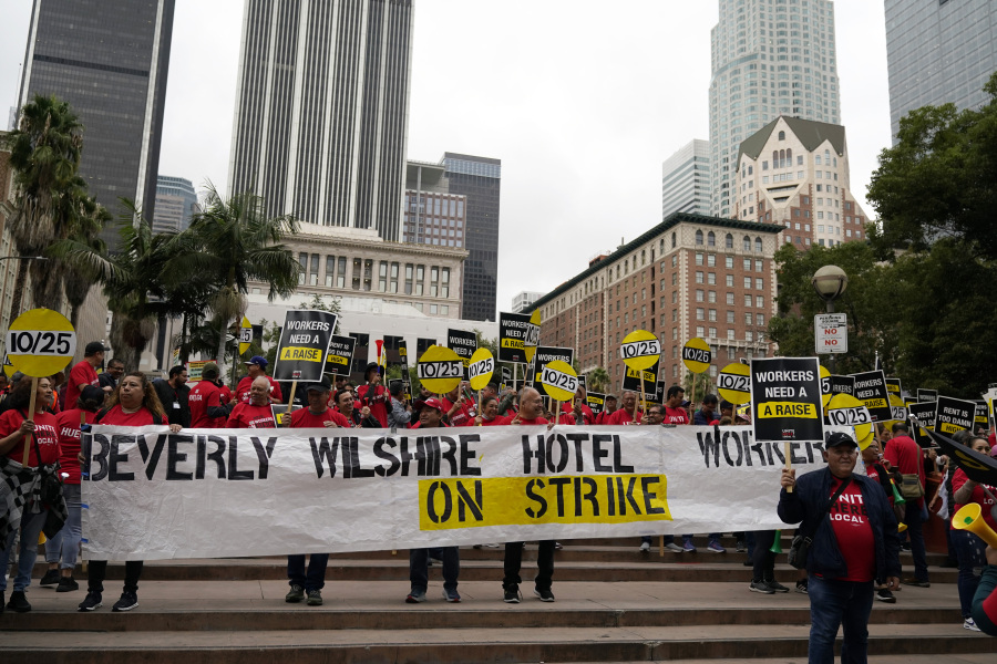 Hotel workers join a protest demanding better wages Wednesday, Oct. 25, 2023, in Los Angeles.