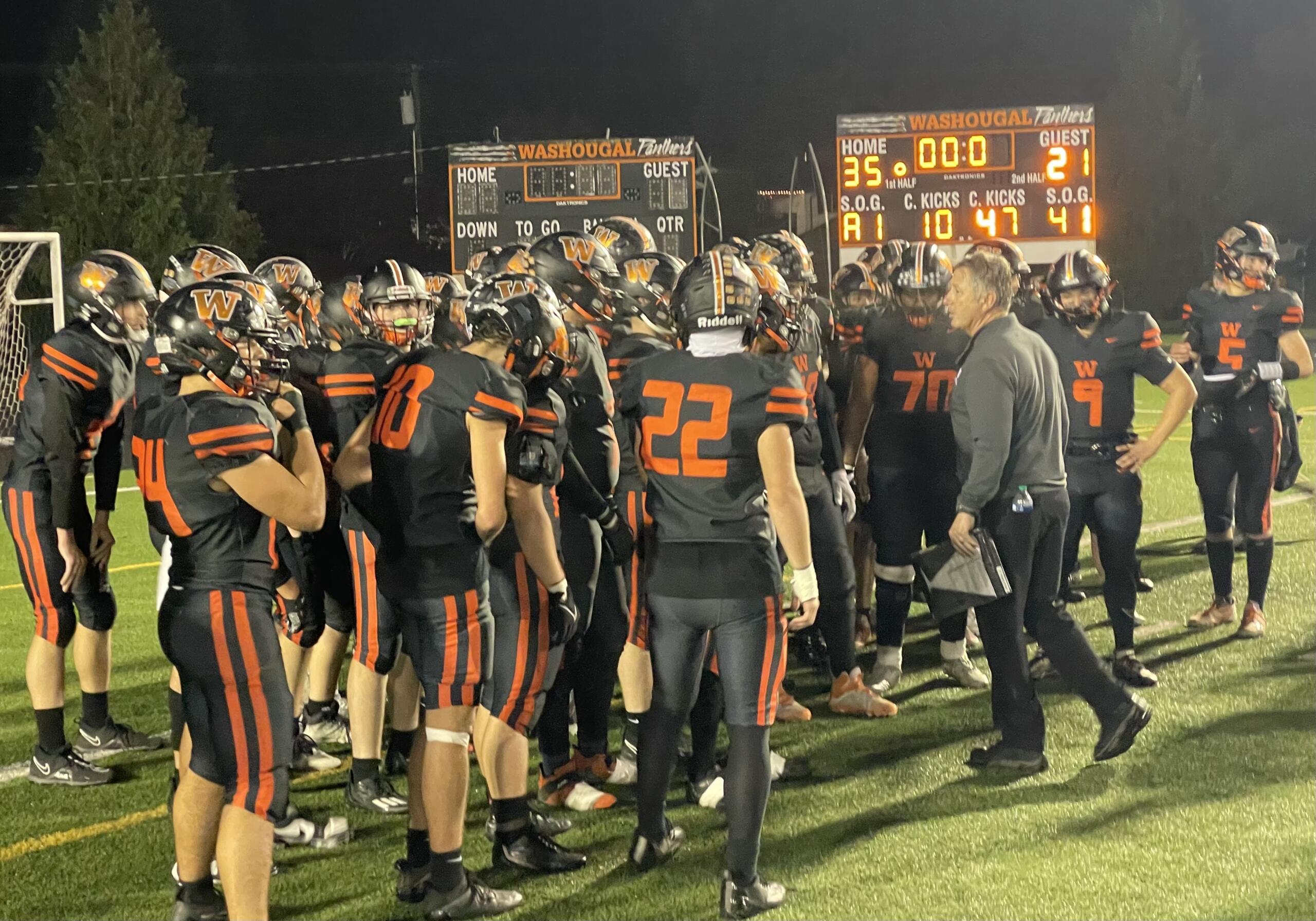 Washougal players gather with coaches on the field following the Panthers' 35-21 win over Aberdeen in the Class 2A district playoffs on Saturday, Nov. 4, 2023, at Washougal High School.