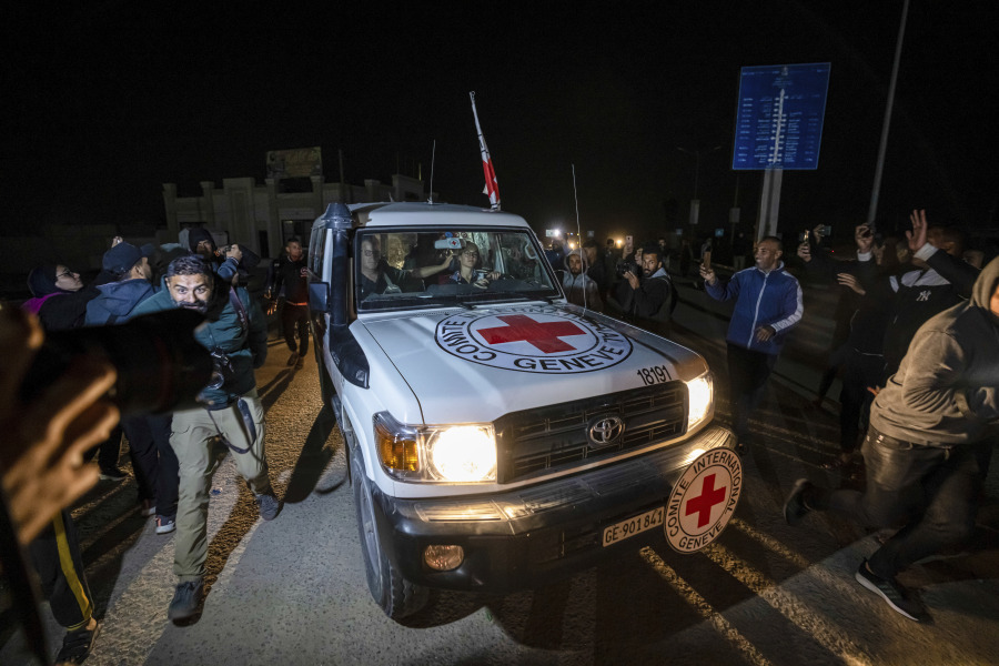 A Red Cross convoy carrying Israeli and foreign hostages heads to Egypt from the Gaza Strip at the Rafah border crossing on Sunday, Nov. 26, 2023.